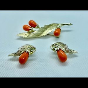 Brooch with clip on earrings.